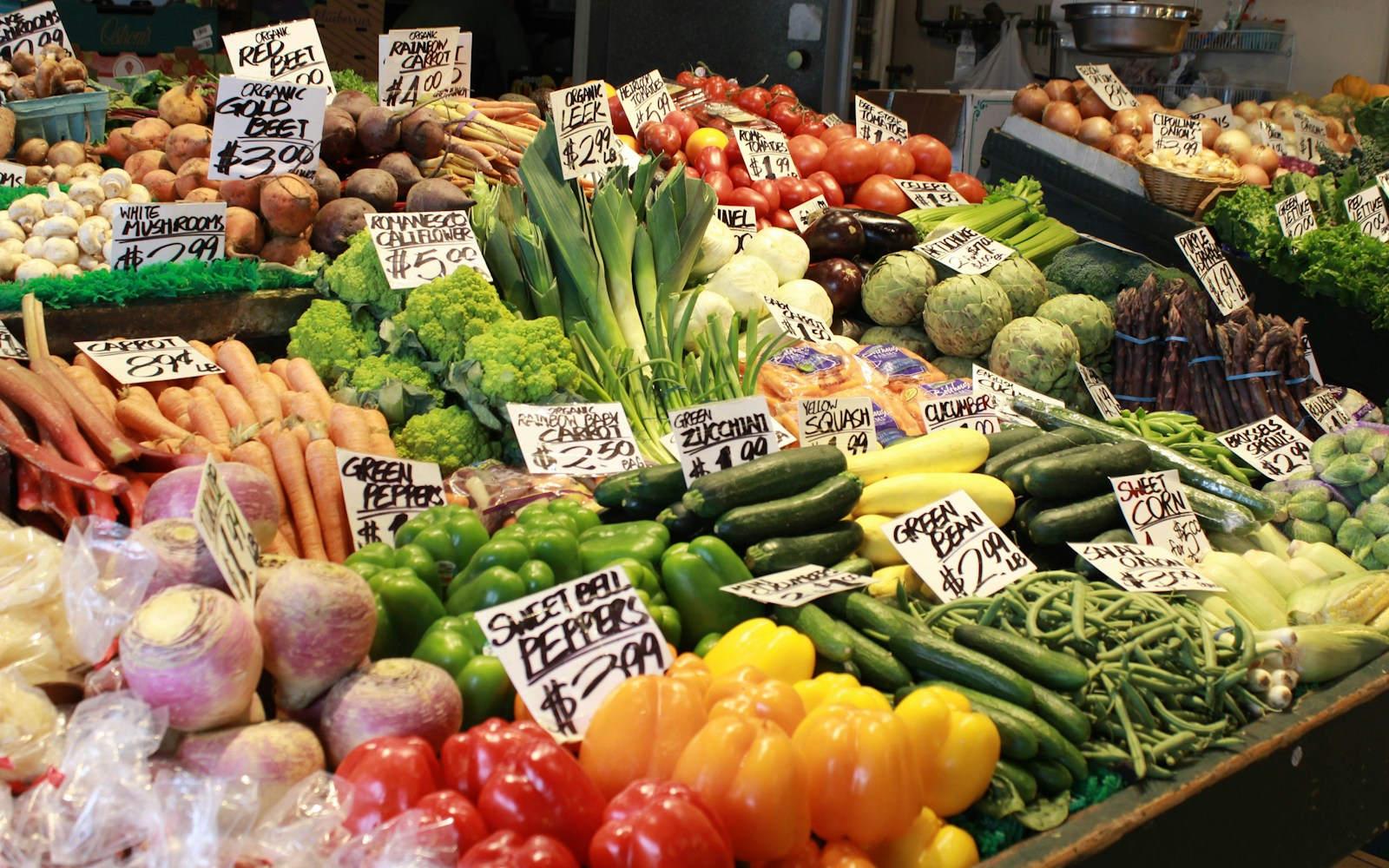 Fresh vegetables arranged on a market stall — illustrative stock image